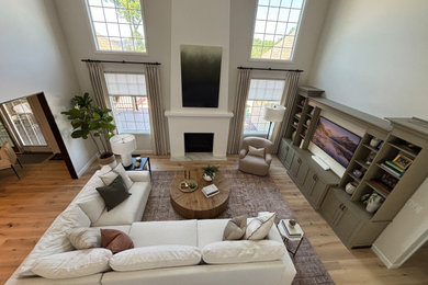 Example of a transitional light wood floor family room design in St Louis