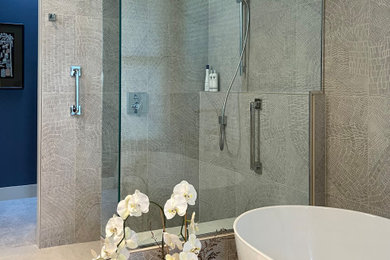 Inspiration for a large modern ensuite bathroom in Portland with flat-panel cabinets, light wood cabinets, a freestanding bath, a built-in shower, a bidet, multi-coloured tiles, porcelain tiles, white walls, porcelain flooring, a submerged sink, quartz worktops, white floors, an open shower, blue worktops, a shower bench, double sinks and a floating vanity unit.
