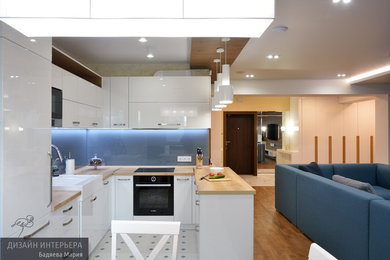 Источник вдохновения для домашнего уюта: угловая кухня-гостиная среднего размера в современном стиле