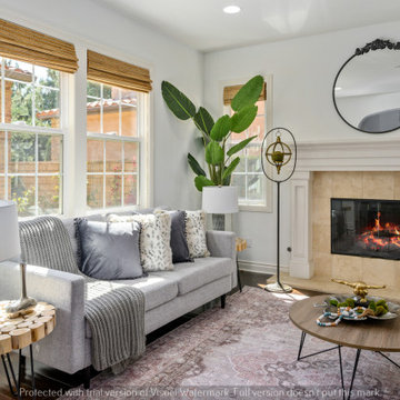 Living Room with Plenty of Natural Light and a Stone Fireplace