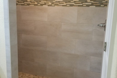 Example of a mid-sized transitional ceramic tile, beige floor, single-sink and vaulted ceiling bathroom design in Richmond with shaker cabinets, white cabinets, a one-piece toilet, white walls, a console sink, a niche and a built-in vanity
