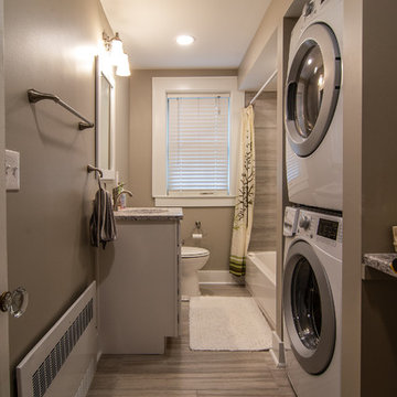 Transitional guest bath with a spa like feel and built in space for washer dryer
