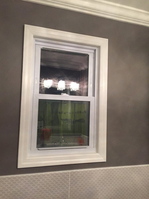 Window blinds and picture for small bathroom