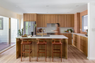Example of a mid-century modern kitchen design in Vancouver