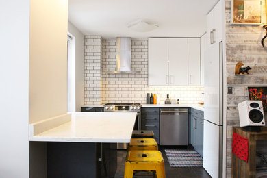 Mid-sized trendy l-shaped medium tone wood floor and brown floor eat-in kitchen photo in New York with an undermount sink, flat-panel cabinets, white cabinets, quartz countertops, white backsplash, ceramic backsplash, stainless steel appliances and an island