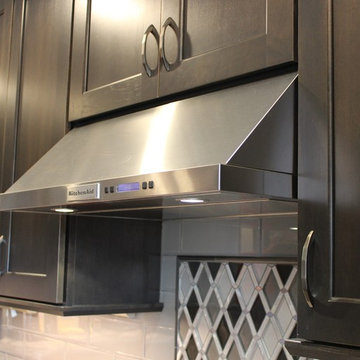 DuraSupreme Peppercorn Kitchen With Cambria Tops and Black Stainless Appliances