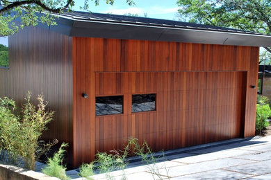 Design ideas for a large contemporary attached two-car garage in Austin.