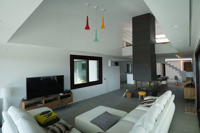 Example of a huge trendy living room design in Madrid