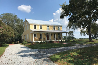 Example of a cottage exterior home design in Charlotte