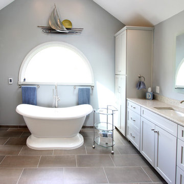 Gray Vanity with Freestanding Tub and Tiled Walkin Shower