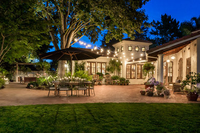 Large tuscan brick patio photo in San Francisco with no cover