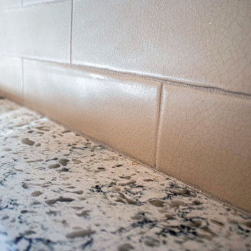 2 Tone Gray Kitchen with Quartz Countertop and Crackle Tile Backsplash