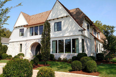 Large transitional white two-story concrete fiberboard exterior home photo in Nashville with a shingle roof