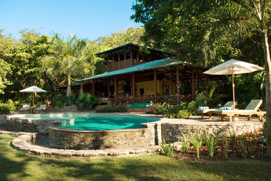 Pool - backyard stone infinity pool idea in Other