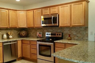 Example of a minimalist kitchen design in Detroit with no island