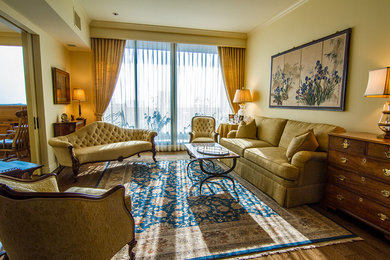Example of a mid-sized formal and enclosed medium tone wood floor living room design in Houston with yellow walls, no fireplace and no tv
