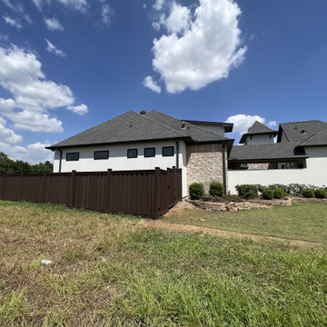 Dark Brown Composite Trex Fence and Black Iron Fence