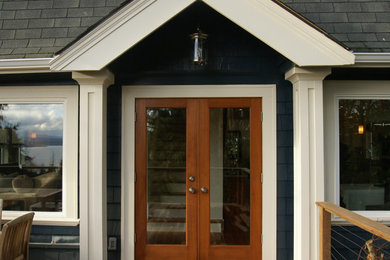 Example of a mid-sized transitional backyard deck design in Seattle with no cover