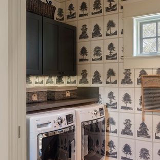 Farmhouse utility room in Houston with shaker cabinets, black cabinets, multi-coloured walls, brick flooring, a side by side washer and dryer and grey worktops.