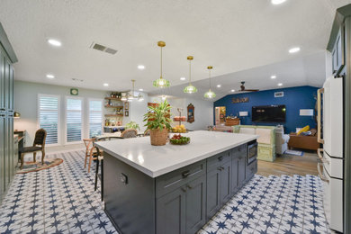 Inspiration for a large l-shaped kitchen remodel in Houston with a farmhouse sink, marble countertops, black backsplash, white appliances, an island and white countertops