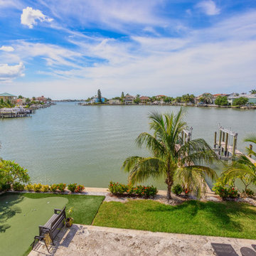 Tranquil Waterfront Oasis with Lush Tropical Backyard and Private Dock Access