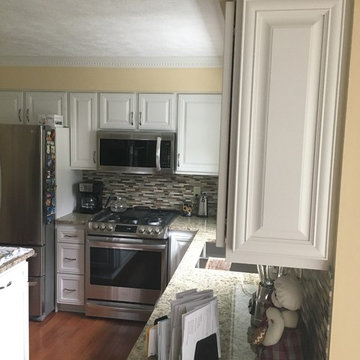 cabinet refacing--antique white with granite, backsplash, and flooring