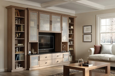 Inspiration for a mid-sized timeless open concept medium tone wood floor family room remodel in Los Angeles with beige walls, no fireplace and a media wall