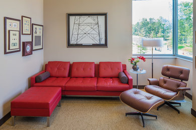 This is an example of a small contemporary enclosed living room in Little Rock with white walls and carpet.