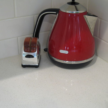 Off-White and Retro Red Accented Kitchen