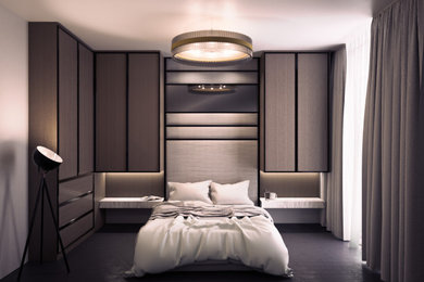 This is an example of a medium sized modern guest bedroom in London with black floors.