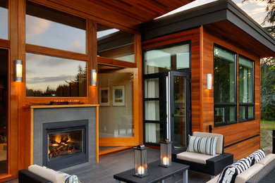 Photo of a contemporary patio in Vancouver with a fire feature.
