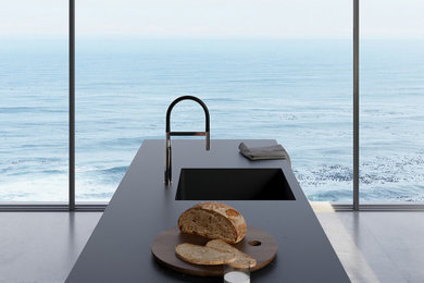 Open concept kitchen - large modern l-shaped open concept kitchen idea in Miami with quartz countertops, white backsplash, quartz backsplash, an island and black countertops