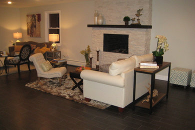 Inspiration for a mid-sized transitional open concept ceramic tile family room remodel in New York with a standard fireplace, a stone fireplace and a wall-mounted tv