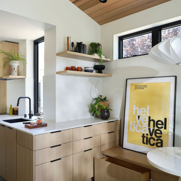 Connected Kitchen and Dining Design in Modern ADU with Bench Storage