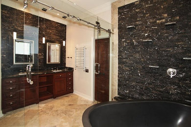 Bathroom - large contemporary master gray tile and stone tile ceramic tile bathroom idea in Houston with raised-panel cabinets, medium tone wood cabinets, beige walls, an undermount sink and marble countertops