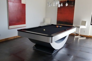 Inspiration for a mid-sized modern concrete floor and black floor enclosed dining room remodel in Phoenix with white walls and no fireplace