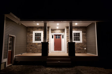 Inspiration for a mid-sized timeless stone house exterior remodel in Boston