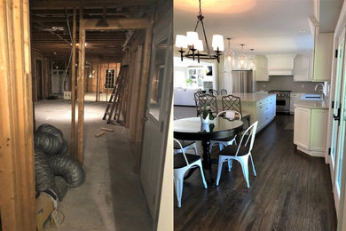 Example of a huge trendy dark wood floor and brown floor eat-in kitchen design in New York with an undermount sink, white cabinets, quartzite countertops, gray backsplash, ceramic backsplash, stainless steel appliances and an island