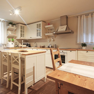 Large rural walk-out basement in Milan with multi-coloured walls, painted wood flooring, a standard fireplace, a concrete fireplace surround and brown floors.