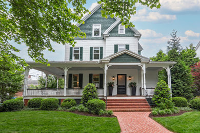 Example of a classic multicolored three-story mixed siding and shingle exterior home design in Baltimore with a shingle roof and a gray roof