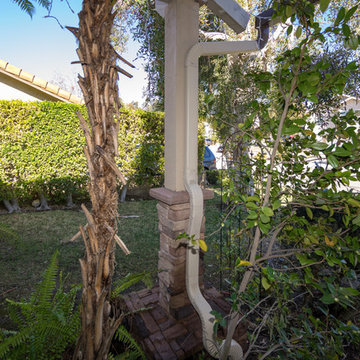 Exterior Post with Stacked Stone and Downspout