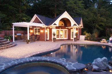 Inspiration for a small timeless one-story brick gable roof remodel in Charlotte