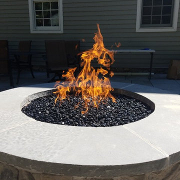 Patio with stone wall and fire pit