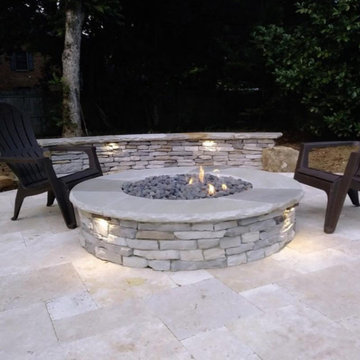 Travertine Patio with fire pit and seating wall