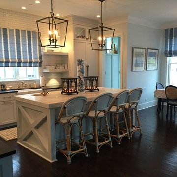 A Modern Farmhouse Kitchen with French Touches featuring a 48" BlueStar Range