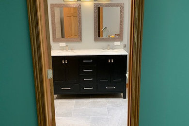 Example of a large master gray tile and porcelain tile ceramic tile and double-sink doorless shower design in Chicago with black cabinets, a two-piece toilet, gray walls and a freestanding vanity