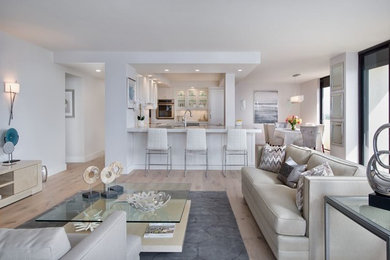 Mid-sized transitional open concept and formal light wood floor and brown floor living room photo in Miami with gray walls and a tv stand