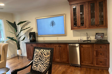 Example of a transitional home bar design in Other