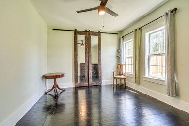 Bedroom - eclectic master dark wood floor and black floor bedroom idea in Dallas with green walls and no fireplace
