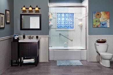 Inspiration for a mid-sized timeless master white tile and subway tile ceramic tile and gray floor bathroom remodel in Chicago with flat-panel cabinets, dark wood cabinets, a two-piece toilet, blue walls and an integrated sink